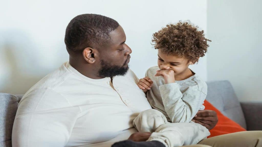 A dad talking to his son