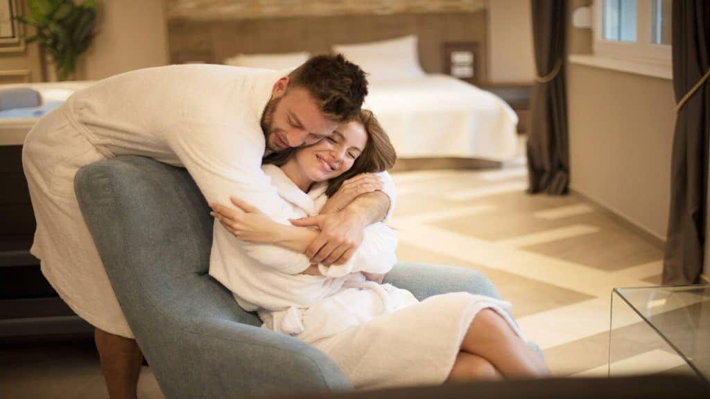 A couple hugging at home