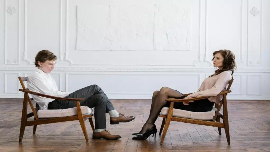 A couple talking in the living room