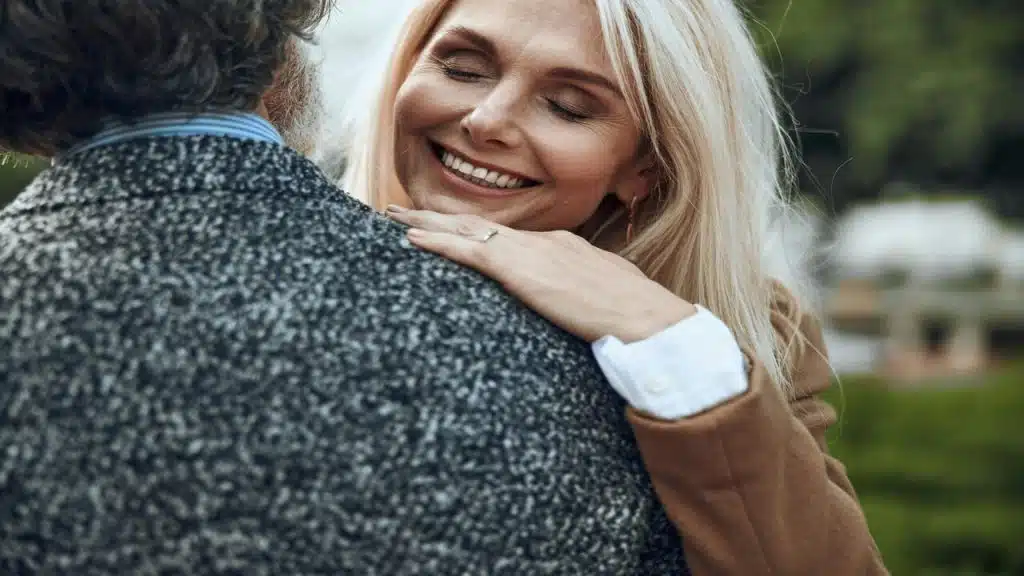 A mature couple hugging each other