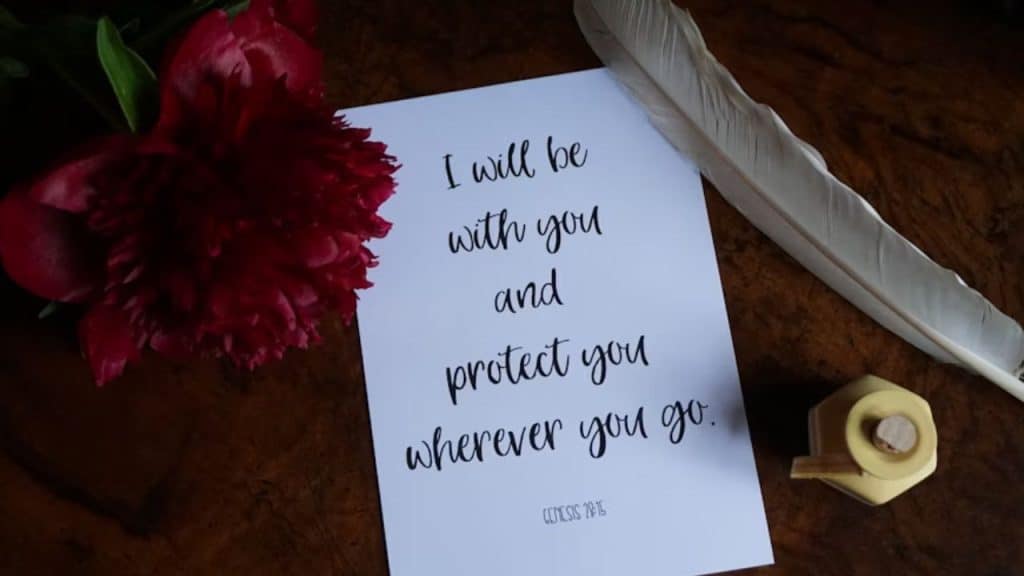 A man leaving a handwritten love note on the countertop of the kitchen