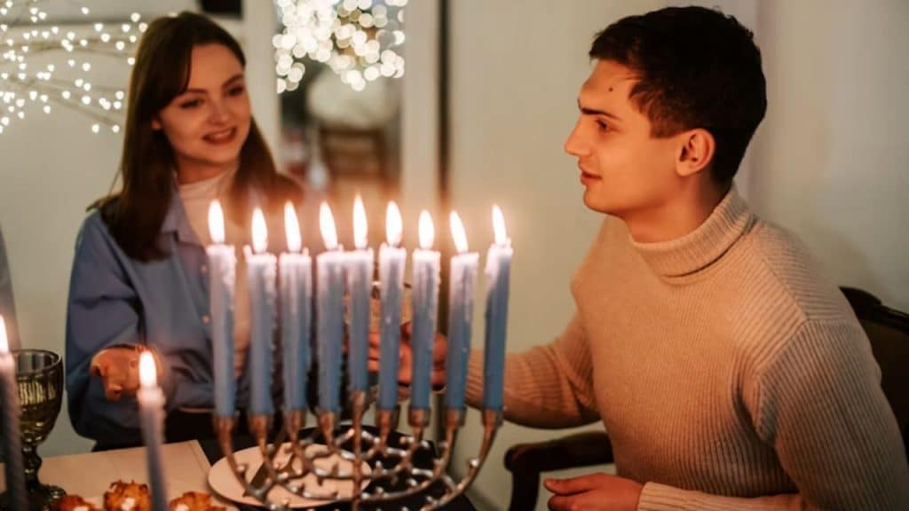 A couple enjoying a candlelit evening at home