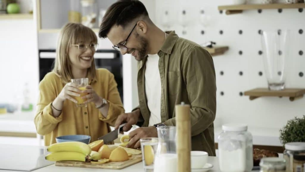 A couple preparing a healthy smoothie together