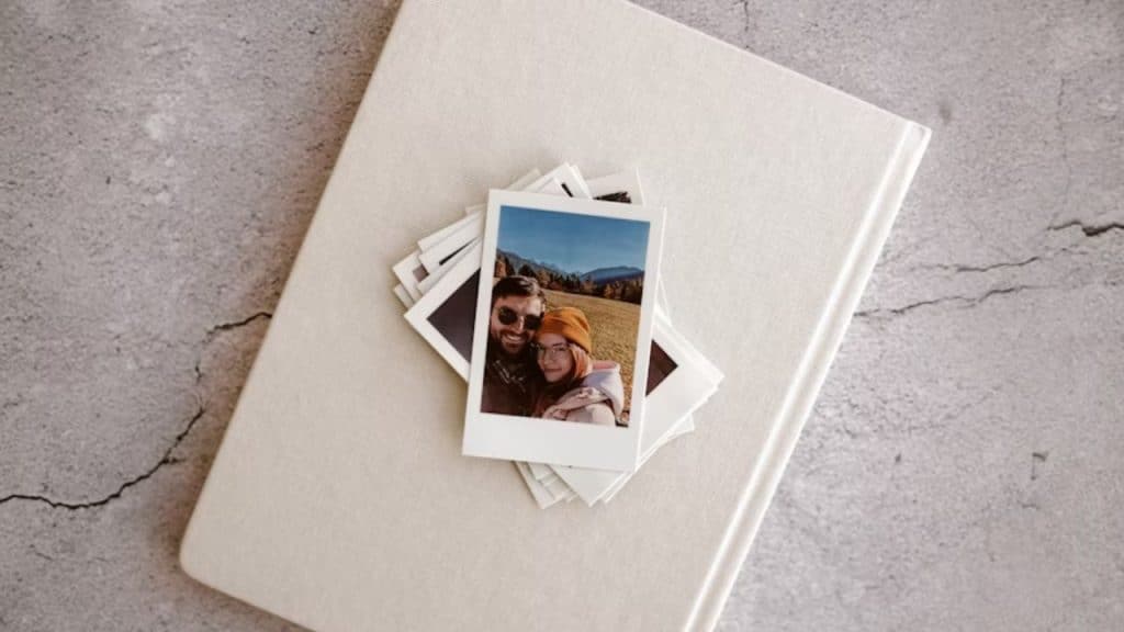 A man making his partner a photo album
