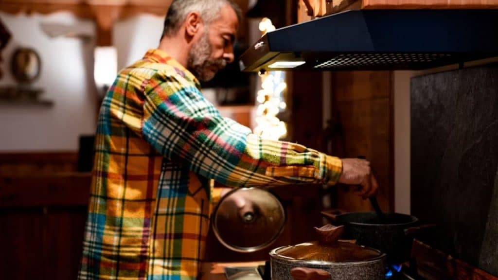 A man cooking a simple dinner for himself.