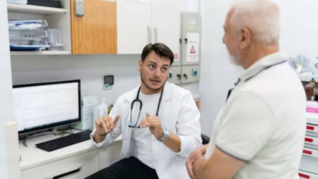 A man consulting with a doctor during a check up.
