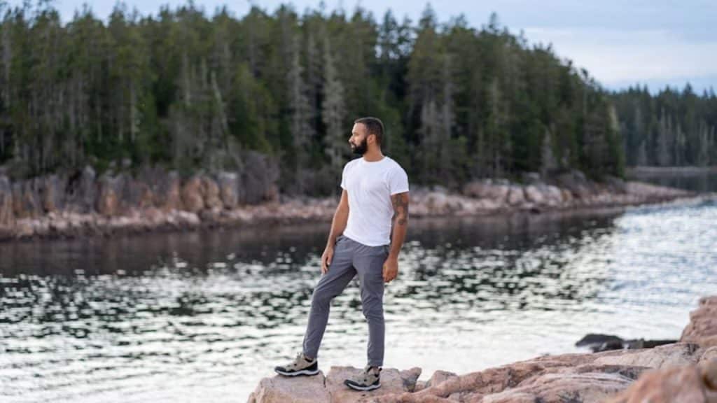 A man standing confidently in nature, reflecting integrity