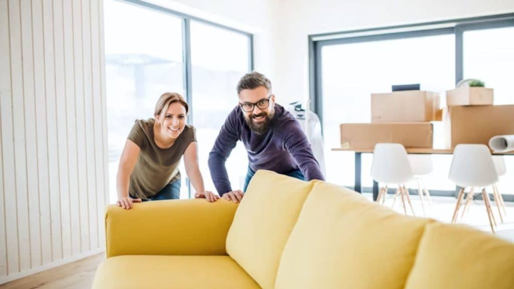 A man and woman adjusting to a new home together