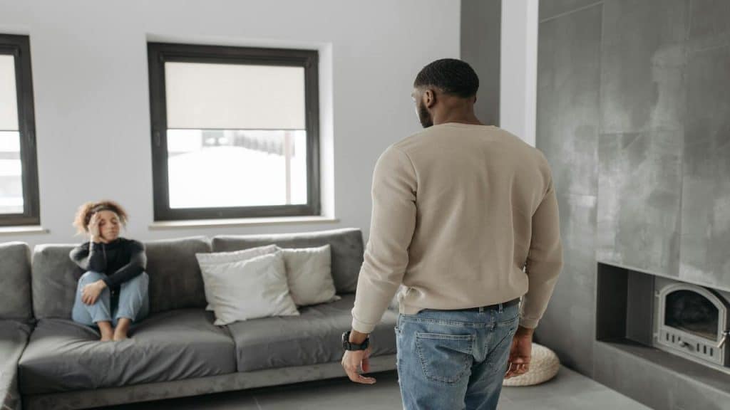 A couple having a serious talk at home