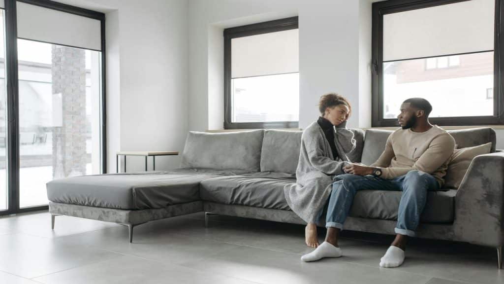 A couple talking in the living room