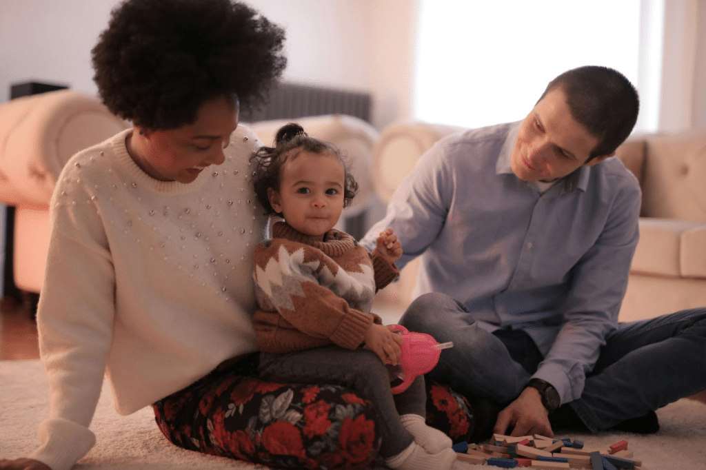 A man and woman with their baby