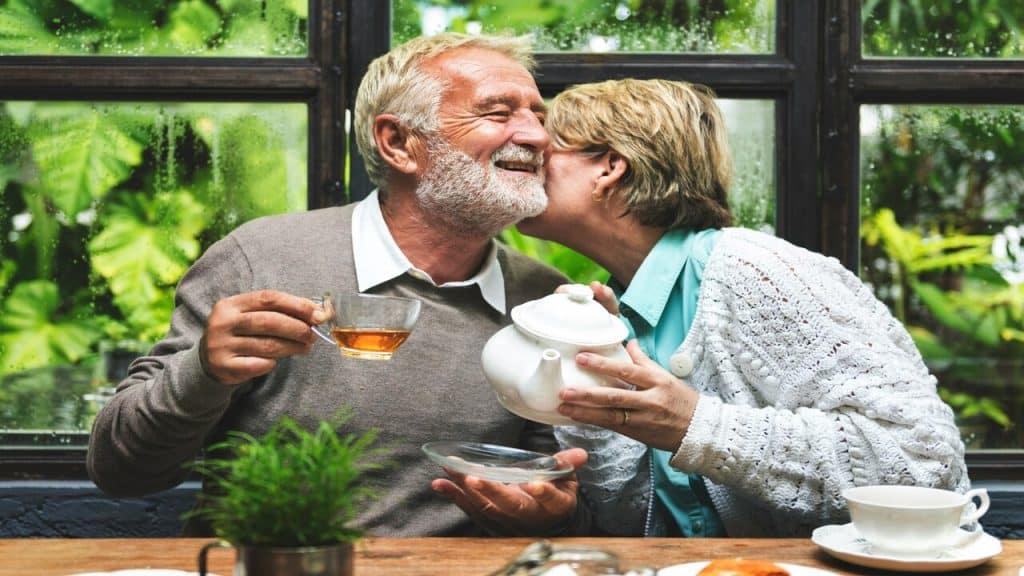 A wife kissing her husband