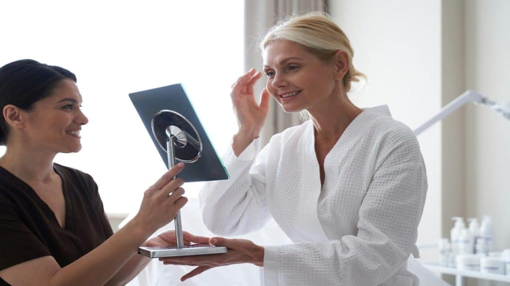 A beautiful mature woman with an esthetician