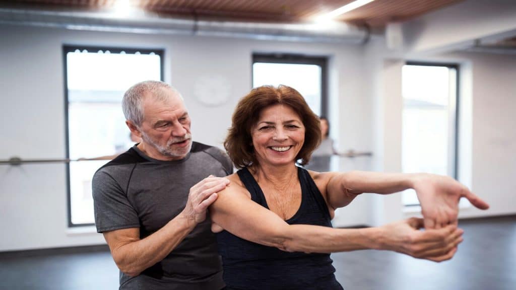 A senior couple exercising together