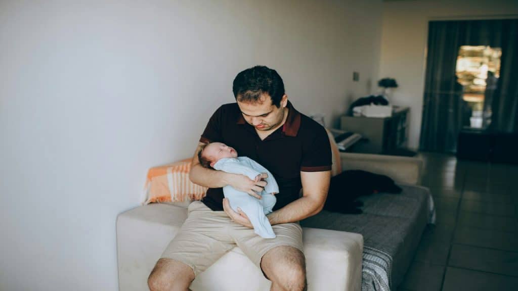 A dad taking care of his baby