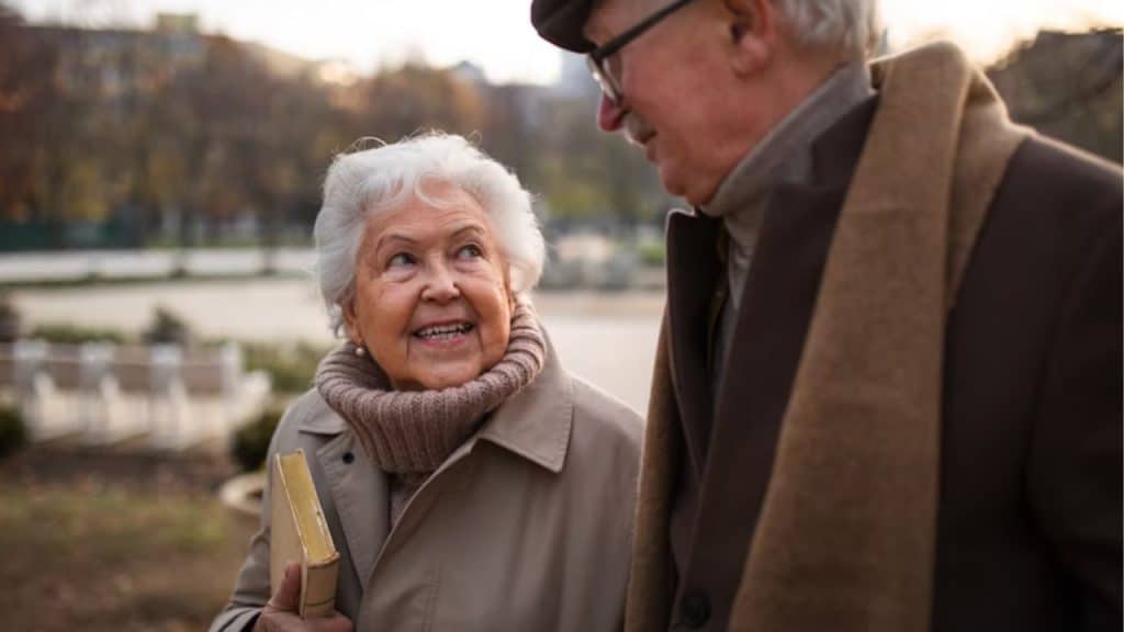 A man listening intently to his wife share a story