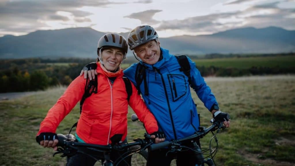 A couple biking together in the countryside