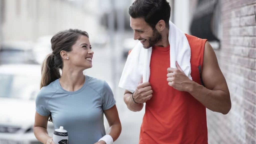 A woman supporting her partner finishing a run