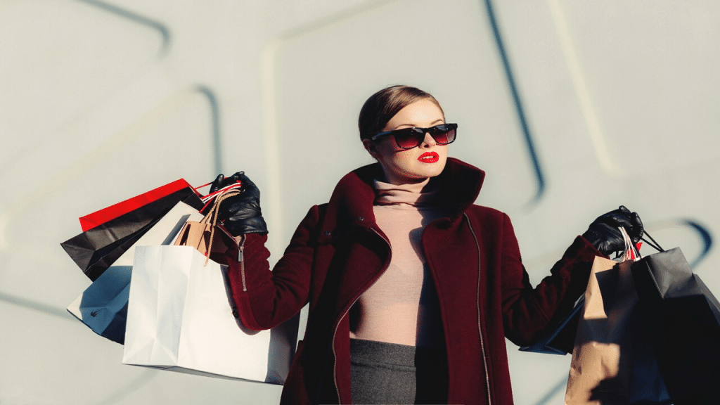 A woman carrying a lot of shopping bags