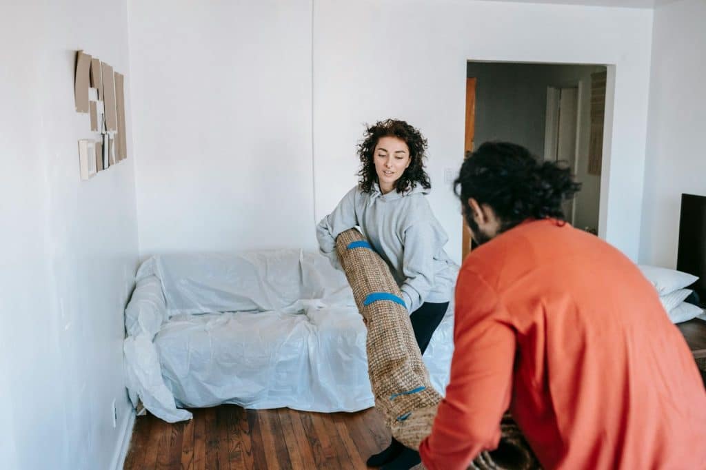 A man and woman helping each other