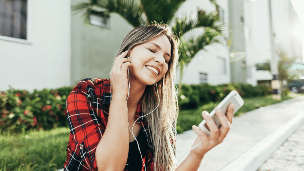 A woman enjoying music by herself