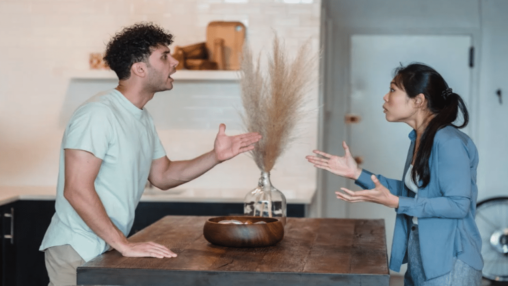 A couple arguing in the kitchen