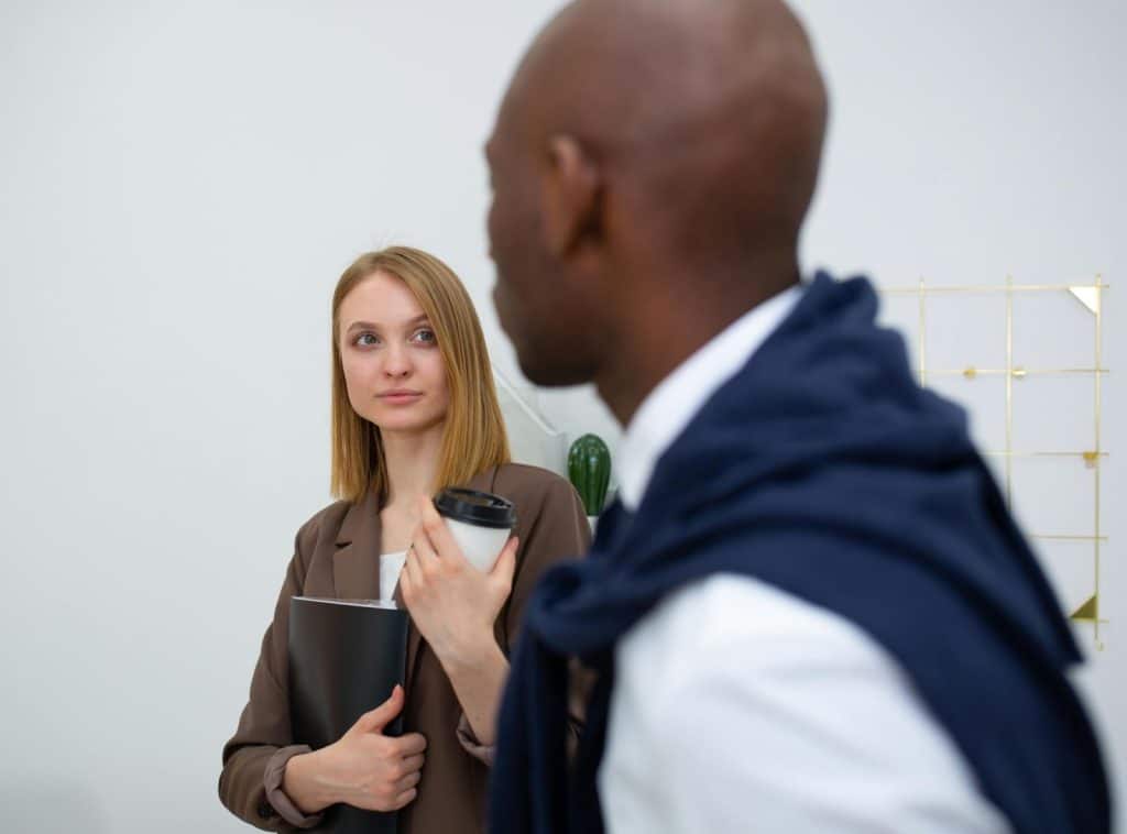 A woman looking at the man