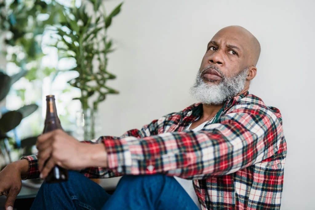 A man holding a beer