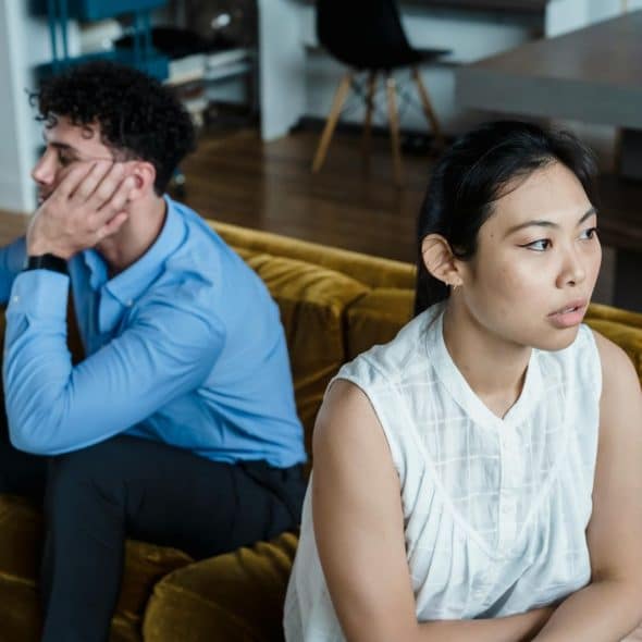 A man and woman looking tired