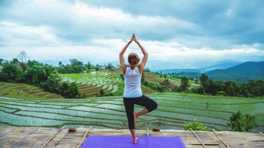 Woman doing yoga outdoors