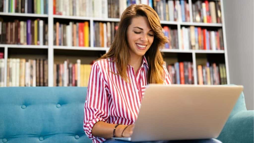 Confident woman working on a laptop at home