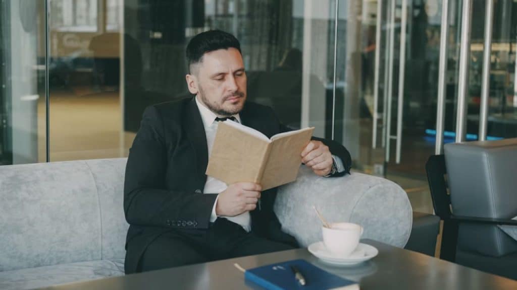 Man reading a self improvement book