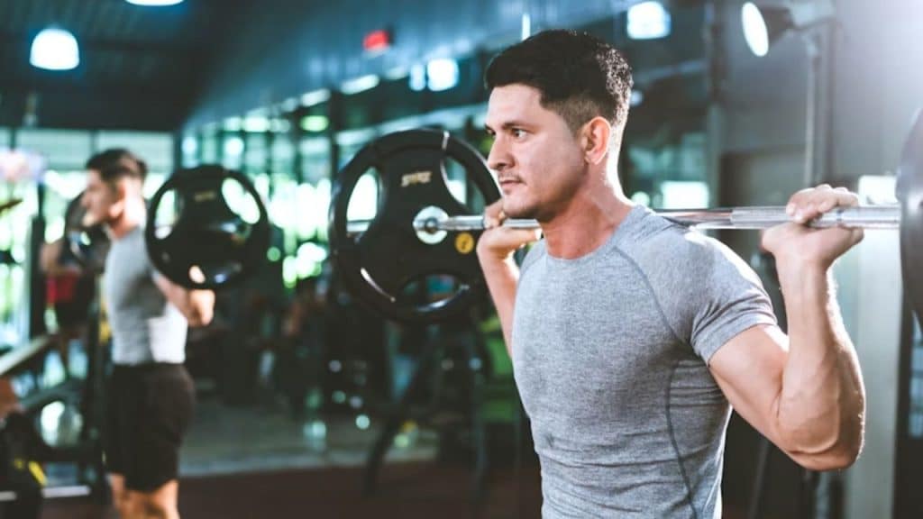 Man training with weights in the gym