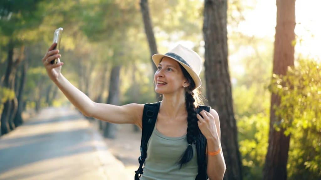 Woman smiling while enjoying a nature walk
