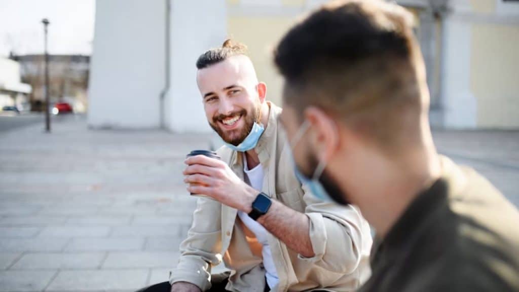 Man smiling naturally during a casual chat
