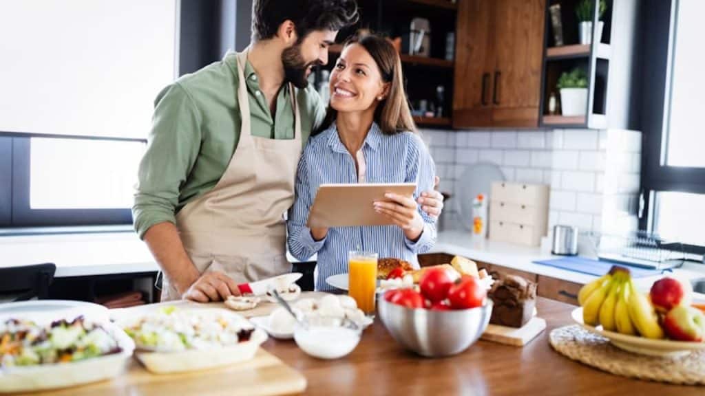Couple cooking a meal together in the kitchen