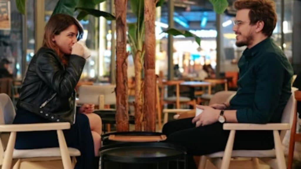 Couple sitting across from each other with comfortable distance