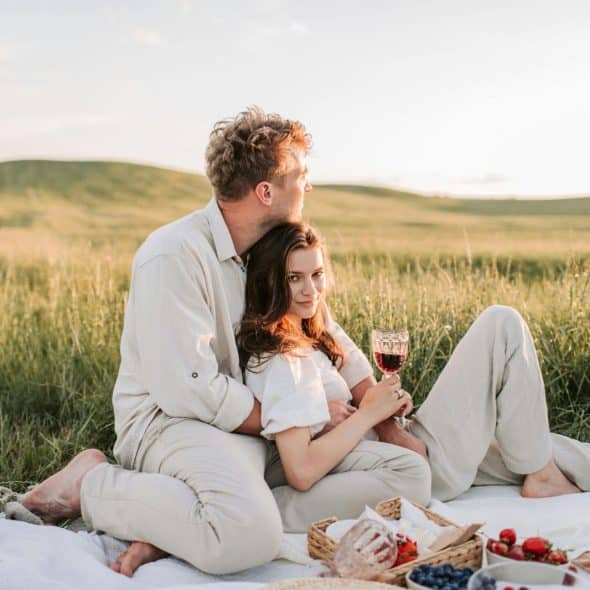 A man and woman having a picnic.