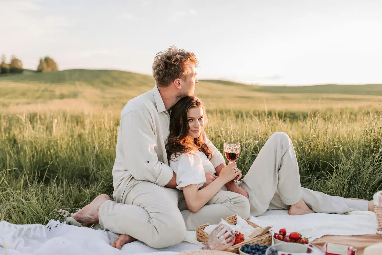 A man and woman having a picnic.