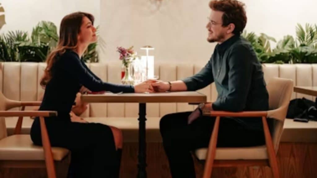 Man smiling and shaking woman’s hand goodbye warmly