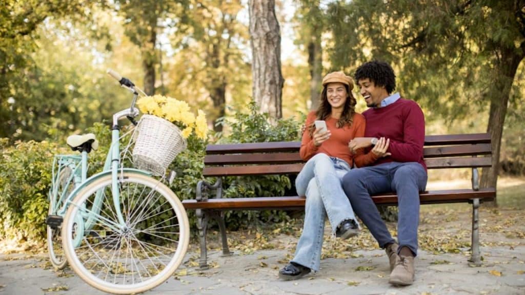 Couple sitting quietly together on a park bench