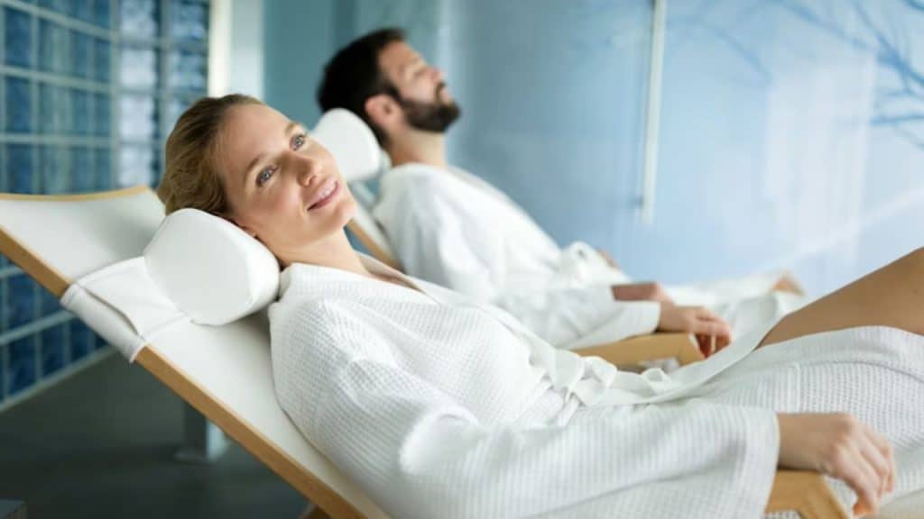 Man sleeping peacefully while woman smiles softly