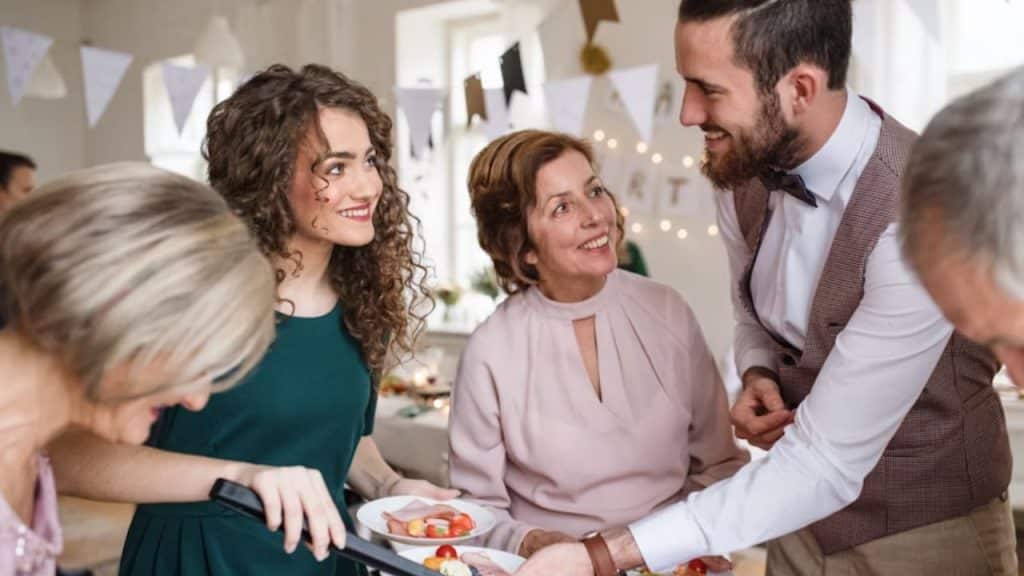 Couple dining with family members at a table