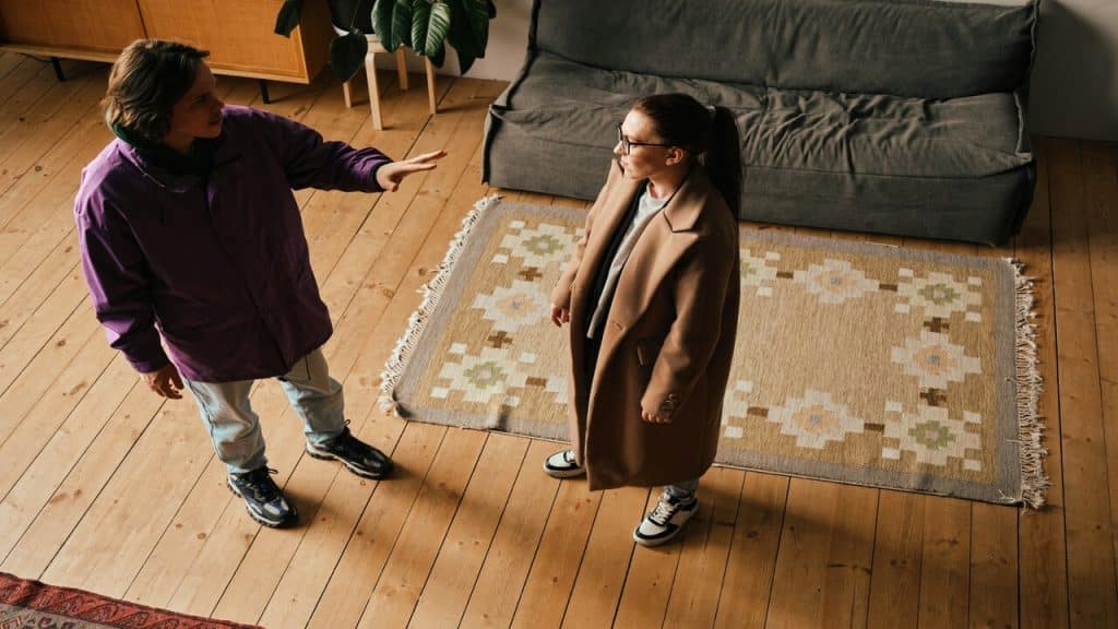 A couple fighting in the living room