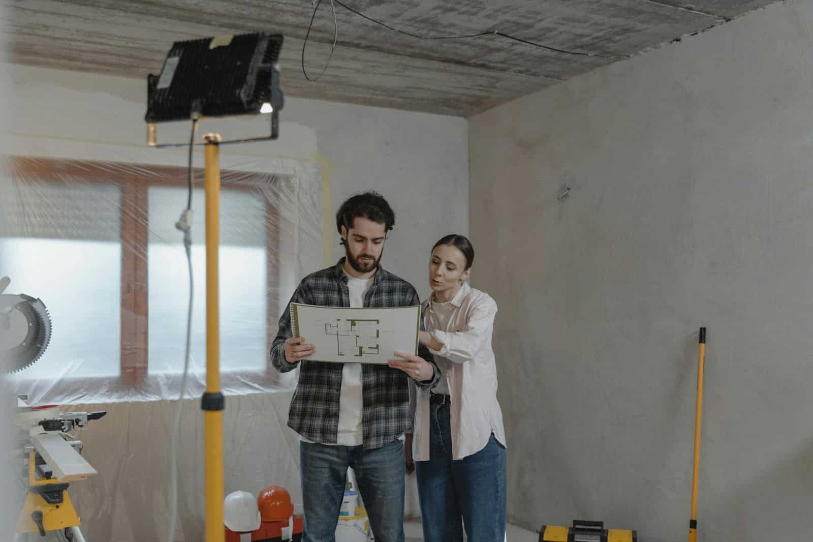 A man and woman planning for their house.