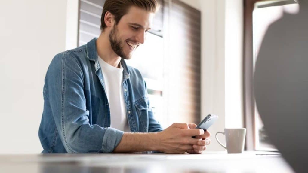 Man sending a simple text message at night after date