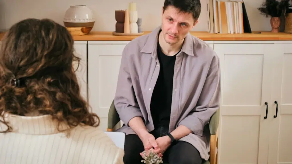 Man sharing a story while woman looks indifferent