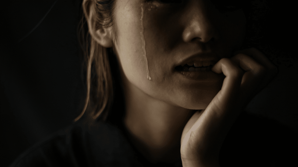 A woman crying in the dark 