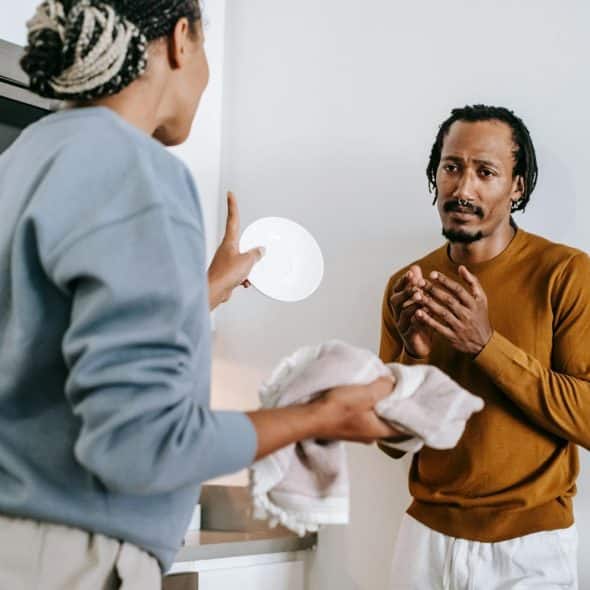 A woman saying something to man