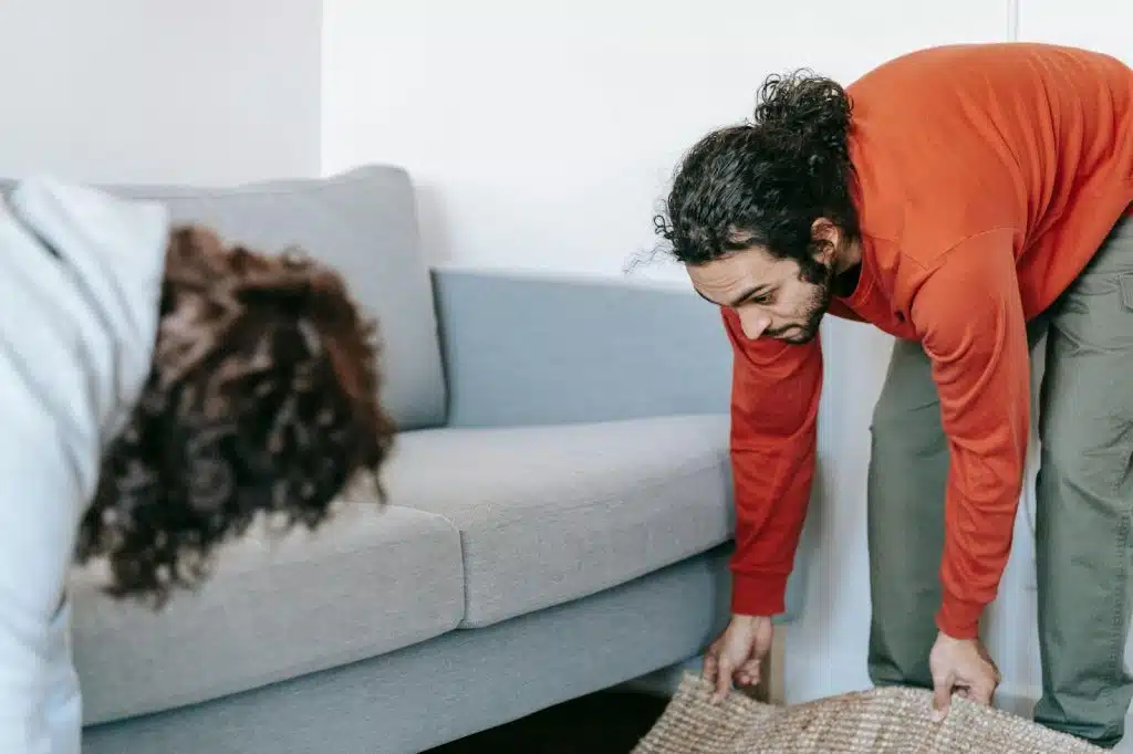 A man helping a woman 
